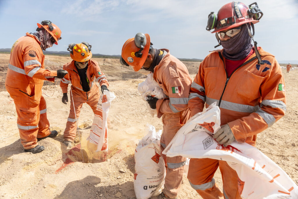 Setting explosives for pit expansion